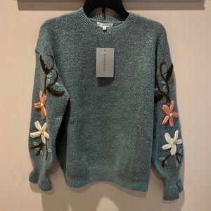 Green embroidered sweater